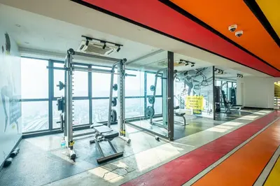 a gym with a view of the city at Blossom Playground with kids friendly home Arte Plus in Kuala Lumpur