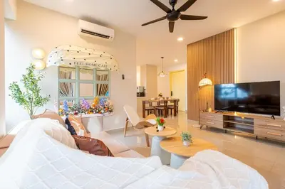 a living room with a couch and a tv at Blossom Playground with kids friendly home Arte Plus in Kuala Lumpur