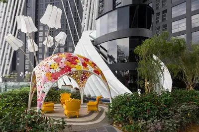 a pavilion with a umbrella and yellow chairs in a city at up tp 9pax with Slide, Rock Climbing, Arcade, near City & MITEC in Kuala Lumpur