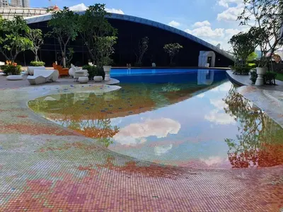 a pool with a reflection of a cloud in the water at up tp 9pax with Slide, Rock Climbing, Arcade, near City & MITEC in Kuala Lumpur