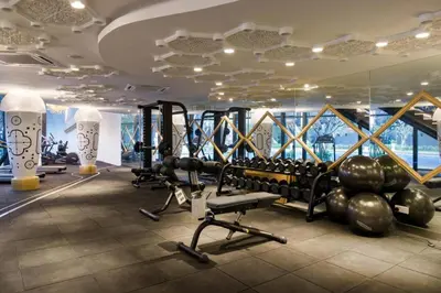 a gym with tread machines and a large window at up tp 9pax with Slide, Rock Climbing, Arcade, near City & MITEC in Kuala Lumpur