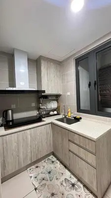 a kitchen with a sink and a counter top at AF Guesthouse Kampung Baru, KL in Kuala Lumpur