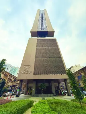 a tall building with the ak sign on it at Axon Residensi Bukit Bintang in Kuala Lumpur