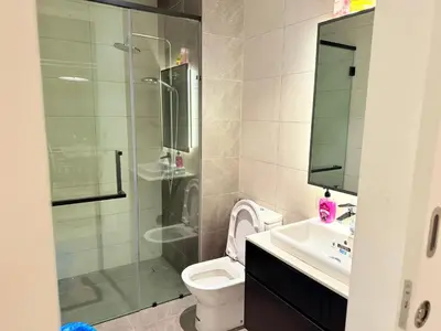 a bathroom with a shower and a toilet and a sink at Axon Residensi Bukit Bintang in Kuala Lumpur