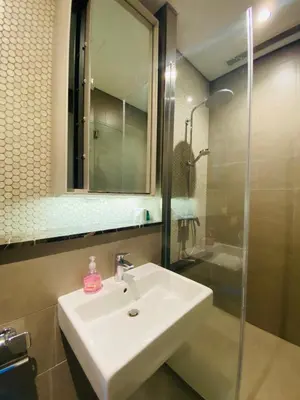 a bathroom with a sink and a shower and a mirror at Lucentia Residences Bukit Bintang KLCC By LUZBNB in Kuala Lumpur