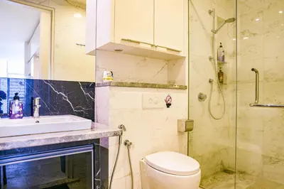 a bathroom with a toilet and a sink and a shower at The Platinum KLCC By Aura Suites in Kuala Lumpur