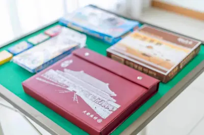 a group of books sitting on a glass shelf at Karaoke Party Penthouse at KL Gateway by Cobnb in Kuala Lumpur