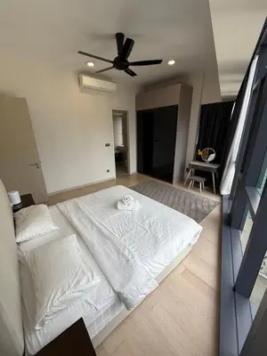 a large white bed in a bedroom with a ceiling at Star Residences KLCC by Nexus 3A in Kuala Lumpur