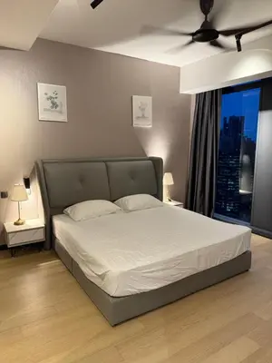 a bed in a bedroom with a ceiling fan at Star Residences KLCC by Nexus 3A in Kuala Lumpur