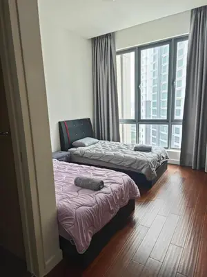 two beds in a room with a large window at KL29 3BR4B Jalan Ampang Near KLCC in Kuala Lumpur