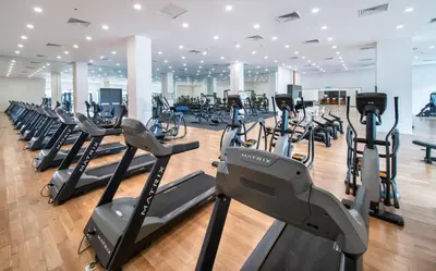 a gym with rows of treadmills and elliptical machines at KL29 3BR4B Jalan Ampang Near KLCC in Kuala Lumpur