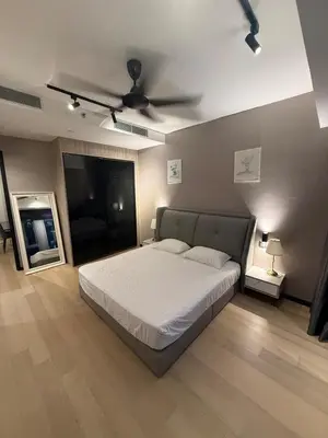 a bedroom with a bed and a ceiling fan at KL Star Residences KLCC By Nexus 38 in Kuala Lumpur