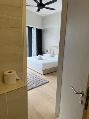 a bedroom with a bed and a ceiling fan at KL Star Residences KLCC By Nexus 38 in Kuala Lumpur