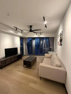 a living room with a couch and a flat screen tv at KL Star Residences KLCC By Nexus 38 in Kuala Lumpur