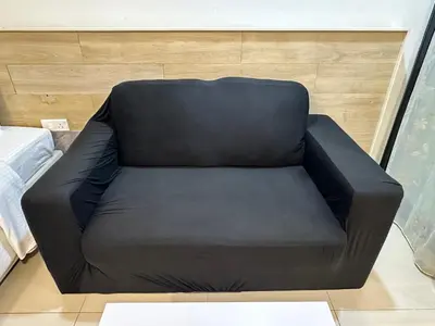 a black leather couch in a room with at Taragon Luxury Suites Bukit Bintang,Kuala Lumpur in Kuala Lumpur