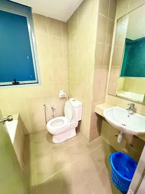 a bathroom with a toilet and a sink at Taragon Luxury Suites Bukit Bintang,Kuala Lumpur in Kuala Lumpur