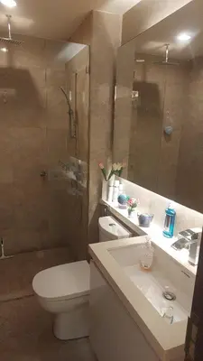 a bathroom with a toilet and a sink and a shower at Damas Plaza-Hartamas in Kuala Lumpur