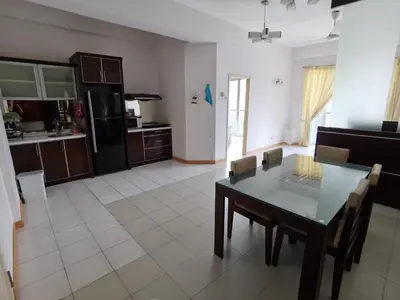 a kitchen and dining room with a table and chairs at Seri Bukit Ceylon in Kuala Lumpur