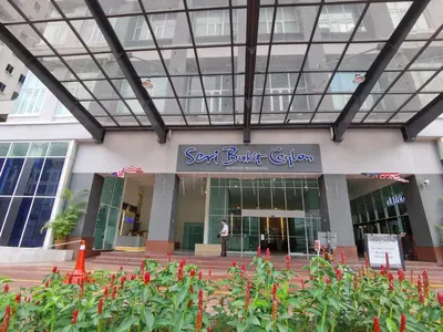 a person standing in front of a building at Seri Bukit Ceylon in Kuala Lumpur