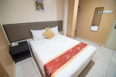 a bed in a hotel room with at SohoTown Hotel in Kuala Lumpur