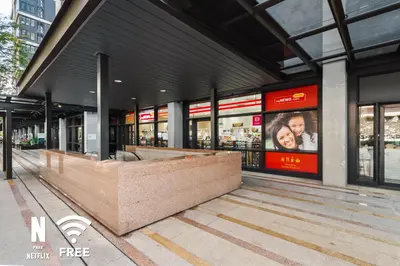 a store front of a building with windows at Arcoris Mont Kiara 3 min to 163mall 2 Bed in Kuala Lumpur