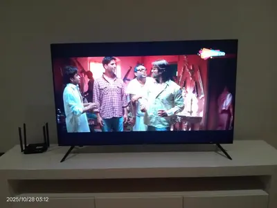 a flat screen tv with a group of people on it at Star klcc by AR Accommodation in Kuala Lumpur