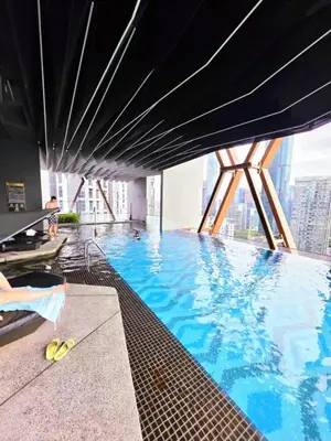 a large swimming pool with a view of a building at Scarletz KLCC By AR Hospitality in Kuala Lumpur