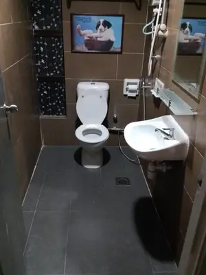 a bathroom with a toilet and a sink at J Hotel Bukit Bintang in Kuala Lumpur