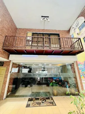 arium of a building with a balcony on top of it at J Hotel Bukit Bintang in Kuala Lumpur