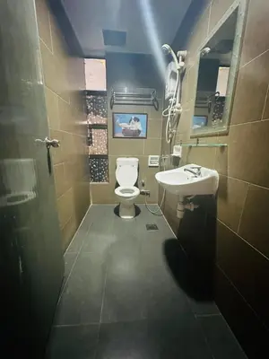 a bathroom with a toilet and a sink at J Hotel Bukit Bintang in Kuala Lumpur