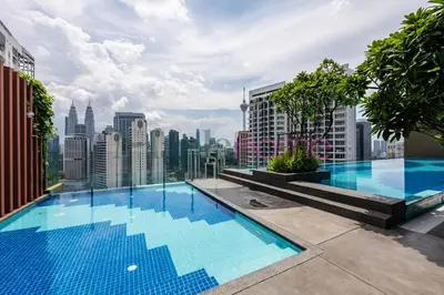 a swimming pool on the roof of a building at Majestic Residence Premier Suites Kuala Lumpur in Kuala Lumpur
