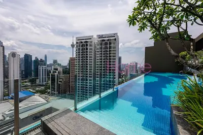 a swimming pool on the roof of a building at Majestic Residence Premier Suites Kuala Lumpur in Kuala Lumpur
