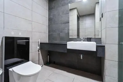 a bathroom with a white toilet and a sink at Blueground Kuala Lumpur pool nr Lake Gardens KUL-1 in Kuala Lumpur