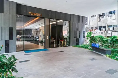 a view of a building with a sign on it at Blueground Kuala Lumpur pool nr Lake Gardens KUL-1 in Kuala Lumpur
