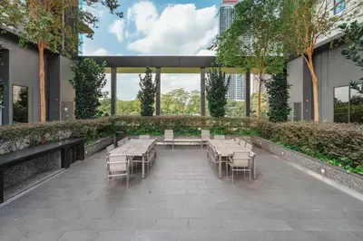 a courtyard with tables and chairs in a building at Blueground Kuala Lumpur pool nr KL Bird Park KUL-3 in Kuala Lumpur