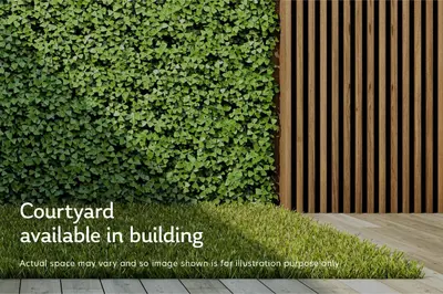 a green hedge with the wordscourt yard available in building at Blueground Kuala Lumpur pool nr KL Bird Park KUL-3 in Kuala Lumpur