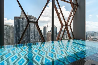 a swimming pool on the top of a skyscraper at Blueground Kuala Lumpur rooftop pool nr KLCC KUL-6 in Kuala Lumpur