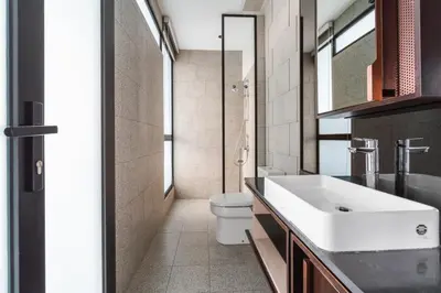 a bathroom with a white sink and a toilet at Blueground Kuala Lumpur rooftop pool nr KLCC KUL-7 in Kuala Lumpur
