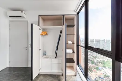 a room with a closet with a large window at Blueground Kuala Lumpur rooftop pool nr KLCC KUL-7 in Kuala Lumpur