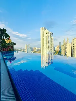 a large swimming pool with a view of a city at Majestic Residence KLCC By AFA in Kuala Lumpur