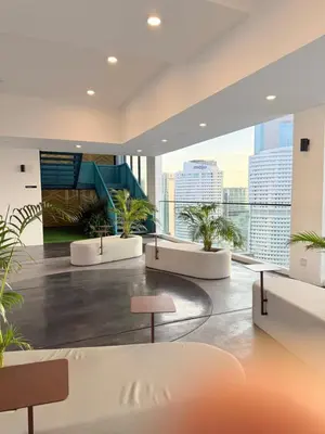 a lobby with potted plants in a building at Majestic Residence KLCC By AFA in Kuala Lumpur
