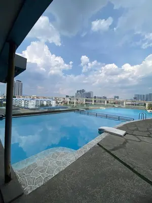 a swimming pool on the roof of a building at nuvea Suites in Kuala Lumpur