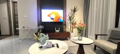 a living room with a television with a lion on the screen at Agile Twilight Residence Apartment in Kuala Lumpur
