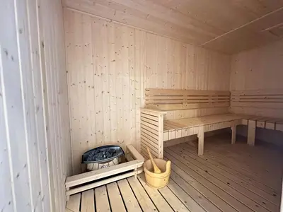 a sauna with a bench and a fire pit at Luxury couple suite Majestic Residence KLCC in Kuala Lumpur