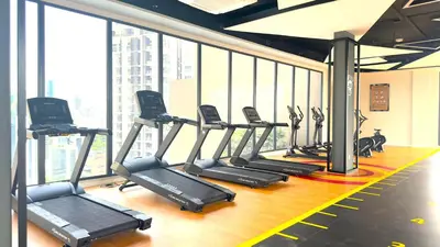 a gym with a row of treadmills in a building at Luxury couple suite Majestic Residence KLCC in Kuala Lumpur