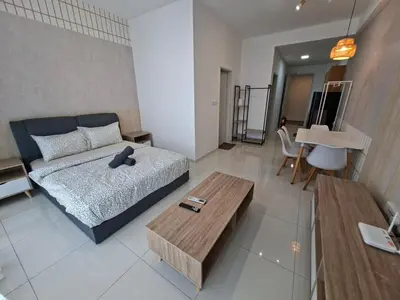 a bedroom with a bed and a coffee table at KLCC Modern Stay, Majestic Residence, 2-5Pax in Kuala Lumpur