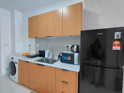 a kitchen with a sink and a black refrigerator at KLCC Modern Stay, Majestic Residence, 2-5Pax in Kuala Lumpur