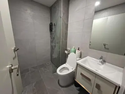 a bathroom with a white toilet and a sink at KLCC Modern Stay, Majestic Residence, 2-5Pax in Kuala Lumpur