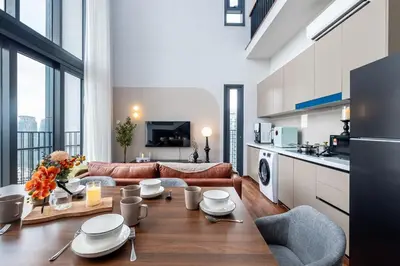 a living room with a couch and a table at Isola KLCC By Feel Home in Kuala Lumpur