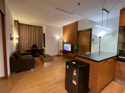 a large living room with a couch and a television at Suit Unit at Dua Sentral in Kuala Lumpur